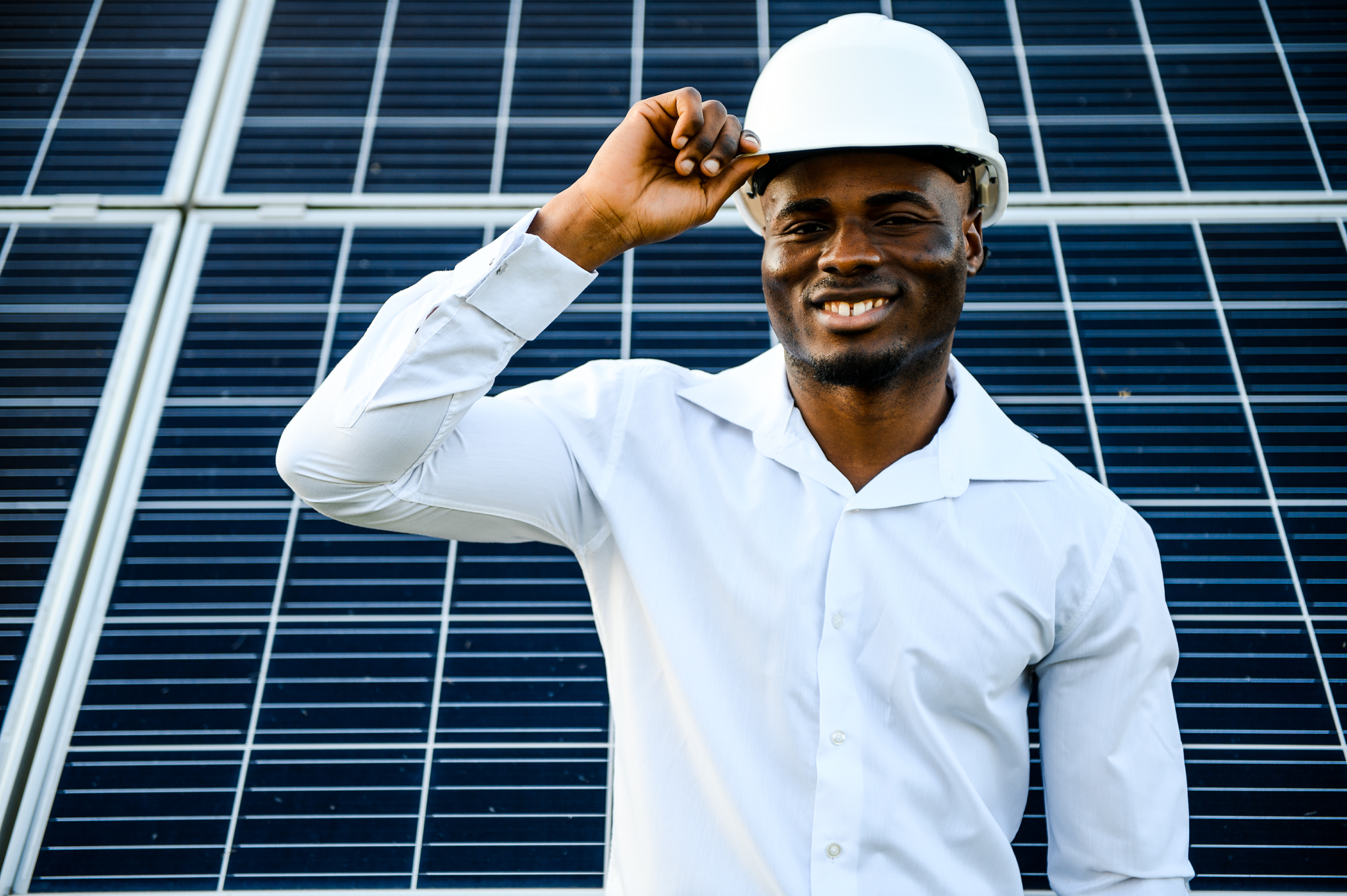 Photovoltaic Green Energy Technology. Worker At Solar Panel Plant.